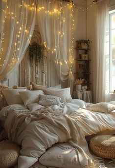 a bed with white sheets and lights hanging from the ceiling in front of a window