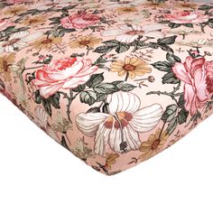 a pink floral bed sheet with flowers on it