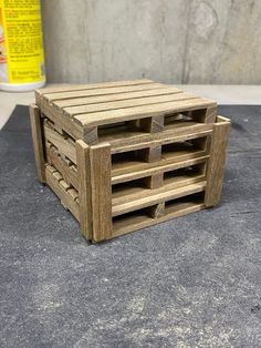 a wooden crate sitting on top of a cement floor