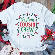 What better way to bring your family together this Christmas than with a set of fun matching family cousin Christmas t-shirts? Featuring the cozy saying, ‘Christmas Cousin Crew’, along with the year, and bright, festive red and green Christmas string lights, your family will look great while celebrating the season of giving and joy. Matching Christmas Tshirts, Cousin Tshirts, Cousins Christmas, Cousin Squad, Cousin Shirts, Diy Christmas Shirts