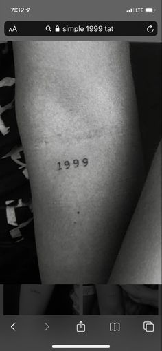 a black and white photo of a person's leg with the word 1989 tattooed on it