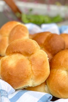 several rolls sitting on top of a blue and white towel