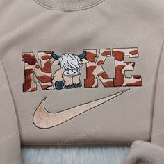 Highland Cow Nike Embroidered Shirt, Trendy Embroidered Sweatshirt, Custom Nike Inspired Shirt Tinicloset is a one-stop shop for anyone looking for fashionable and trendy embroidered clothing. Our high-quality clothing line features a variety of embroidered sweatshirts, t-shirts, and hoodies that are sure to make you stand out from the crowd. One of our most popular items is the Highland Cow Nike embroidered shirt. This shirt combines the timeless beauty of the Scottish highlands with the modern Nike Cow Hoodie, Cow Nike Sweatshirt, Ender Man, Cute Western Outfits, Shop Cart, Nike Inspired, Maroon Hoodie, Circuit Ideas