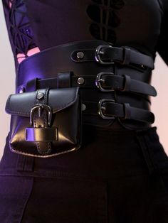 Unleash your inner cyberpunk with our Silver/Black Futuristic Corset Belt with Waist Bag. The corset belt accentuates your waistline, offering a flattering silhouette while adding a touch of cyberpunk flair. The attached waist bag provides convenient storage for your essentials, making it as practical as it is stylish.  Garment Size   	 		 			Size 			Free Size 		 		 			Waist 			65-78 		 		 			Width 			12 Black Steampunk Corset Belt For Halloween, Steampunk Black Corset Belt With Belt Loops, Black Steampunk Corset Belt For Alternative Fashion, Punk Style Black Corset Belt With Included Belt, Gothic Corset Belt For Party With Belt Loops, Black Corset Belt For Halloween Cosplay, Black Punk Corset Belt With Belt Loops, Black Punk Corset Belt, Fitted Punk Corset Belt With Belt Loops