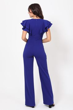 Bella Chics' Royal Blue Jumpsuit with a layered ruffle shoulder is a showstopper. This short sleeve jumpsuit has buckle detail and a plunging v-neck to show off your sexy side. The joint double d-ring trim detail cinches your waist and flows into front-line flared wide leg pants for an elegant look. -Royal Blue Jumpsuit - Bella Chic- Layered Ruffle Shoulder Jumpsuit w/ Buckle Detail- Plunging V, Joint Double D Ring Trim on Waist- Front-line Flared Leg Design, Zipper on Back CONTENTS & CARE- 95% Elegant Short Sleeve Romper With Ruffles, Elegant Blue Jumpsuits And Rompers With Ruffles, Blue Short Sleeve Jumpsuit For Night Out, Blue Short Sleeve Jumpsuits And Rompers For Night Out, Blue V-neck Jumpsuit With Ruffles, Royal Blue Jumpsuit, Short Sleeve Jumpsuit, Blue Jumpsuit, Sequin Rompers