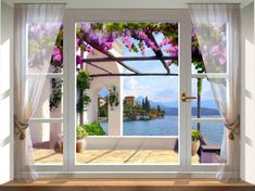 an open window with the view of a lake and flowers on it's side