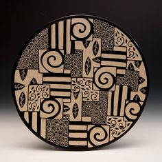 a black and white plate with designs on it