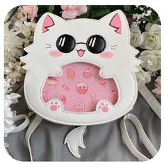 An itabag featuring everyone's favorite cat with sunglasses! This ita bag is made with pu leather as well as cotton insides for a sturdy exterior and a soft interior.  It comes with one main storage compartment as well as 4 internal pockets: one large padded pocket, two smaller open pockets, and one zipper pocket. Itabag Size: 9" x 9" x 3" (14" total with tail and ears) The ita bag includes:  - 1 Removable tail  - 1 Crossbody strap - 2 Backpack style straps - 1 Removable pink insert For extra inserts or Getocat bag, please check out my other shop listings! Tail And Ears, Cat With Sunglasses, 헬로키티 배경화면, Ita Bags, Anime Bag, Kawaii Bags, Ita Bag, Cat Sunglasses, Cat Clothes