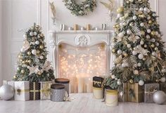 two christmas trees in front of a fireplace decorated with gold and silver ornaments, surrounded by presents