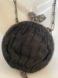 "Lovely Victorian Dainty silk purse with a delicate chain strap known as \"Opera Bags''. These small bags accompanied women on special outings. This bag has a decorative clasp and tassel. Inside are two compartments, one holding a small round mirror on a chain. Body of bag is 3.5\" across. Chain is 8\" long. Tassel is 3\" long. No holes or tears in exterior. Interior fabric is faded and a bit worn looking." Compact Evening Bag With Removable Pouch, Elegant Black Coin Purse For Evening, Victorian Evening Clutch Bag, Victorian Style Evening Clutch Bag, Elegant Black Evening Coin Purse, Elegant Black Pouch Coin Purse, Elegant Black Pouch-style Coin Purse, Elegant Coin Purse For Travel, Elegant Formal Coin Purse With Dust Bag