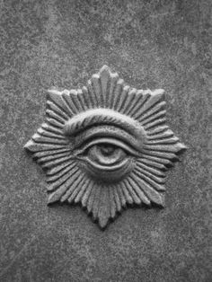 an all seeing symbol on the side of a building