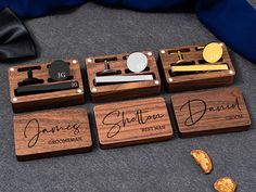 four personalized wooden coasters with engraved names and date on them, sitting next to a pair of gold - plated scissors