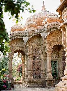 an intricately designed building with arches and pillars