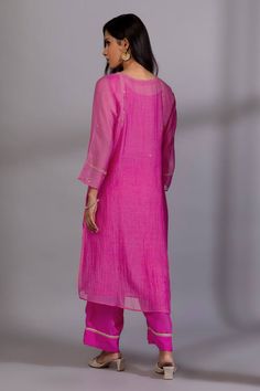 Rani pink kurta with zardozi, sequin placement embroidery. Paired with straight fit pant and dupatta.
Components: 3
Pattern: Embroidery
Type Of Work: Zardozi, sequin
Neckline: Keyhole
Sleeve Type: Three quarter
Fabric: Chanderi Mul, Cotton Silk
Color: Pink
Other Details: 
Lace embellished pant hem
Length:
Kurta: 45 inches
Pant: 37 inches
Dupatta: 2.4 mtrs
Occasion: Sangeet - Aza Fashions Bollywood Style Pink Kurta With Sequins, Festive Pink Kurta With Sequins, Pink Sequined Kurta For Eid, Pink Sequined Kurta For Festivals, Festive Pink Palazzo Set With Sequins, Festive Pink Sequined Kurta, Festive Pink Sequin Kurta, Festive Pink Sequined Palazzo Set, Pink Straight Kurta Pant Set For Designer Wear