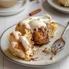 a piece of cinnamon bundt cake on a plate with a bite taken out of it