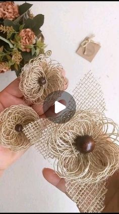 someone is holding some twine balls in their hands