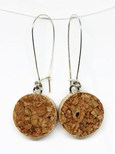 the earrings are made from cork and have silver hooks