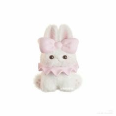 a white stuffed animal with a pink bow on it's head, sitting in front of a white background