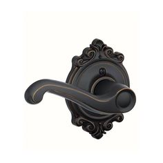 an antique style door handle on a white background