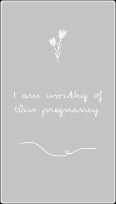 the words i am worthy of this pregnancy are written in white on a gray background