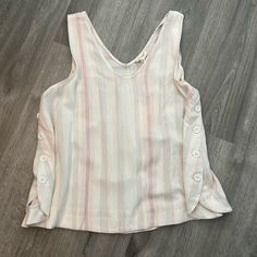 Size Medium Stipe V-Neck And Back. Buttons On Both Sides. Cream With Peach, Light Blue And Burgundy. New With Tags From Dry Goods Striped V-neck Summer Tops, Striped V-neck Tank Top, Striped V-neck Tank Top For Spring, Striped V-neck Vest Top, Striped Sleeveless Blouse For Spring, Pink Sleeveless Vest Top, Pink V-neck Tank Top Casual, Pink V-neck Tank Top Casual Style, Pink V-neck Casual Tank Top