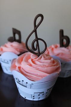 cupcakes with pink frosting and music notes on them