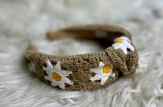 Add a touch of spring and summer to your look with this crochet headband featuring a dainty daisy print. Perfect for adding a cute, fashionable touch to any outfit. Spring Beach Headband, Trendy Spring Beach Headband, Adjustable Headband For Beach In Spring, Casual Beach Hair Accessories For Summer, Casual Summer Beach Hair Accessories, Cute Spring Headband, Trendy Spring Headband, Spring Beach Hair Accessories With Matching Headband, Adjustable Trendy Spring Headband