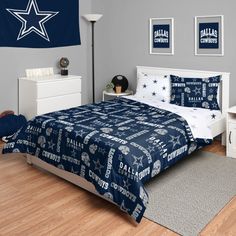 a bed room with a neatly made bed and two pictures on the wall