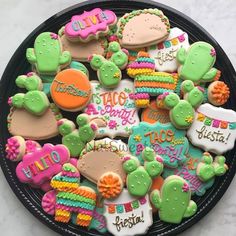 a plate full of decorated cookies that say hello kitty