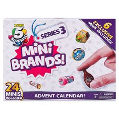 the mini brands calendar is displayed in front of a white box with stickers on it