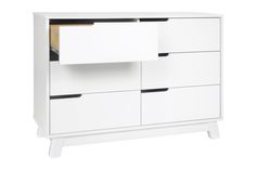 a white dresser with drawers and two doors on the bottom shelf, in front of a white background