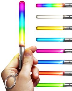 a person holding a lighter in their left hand and seven different colored lights on the other