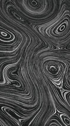 an abstract black and white background with swirly lines in the shape of wavy waves