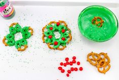 some pretzels and other food items are on a tray next to a can