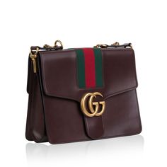 This rare Gucci shoulder bag is a unique piece to add to your collection. The brown leather creates a satchel feel to it, bringing back 1940's class to your wardrobe. This bag is decorated with the classic Gucci colours and it is beautifully embellished with the iconic tiger heads. The Marmont Shoulder bag has 3 compartments, all which have their specific purpose. The two pockets at the front and the back are perfectly thin for storing documents, a sleek wallet, phones - both fasten with a magnetic closure system. The main compartment in the middle sits deep within the bag, and as you add more items, the base of the bag has the ability to expand out. Style with a beige coat and a pair of kitten heels for a timeless feel.?ÿ SPL Exterior  Brown leather exterior Red and green cotton detailing Beige Coat, Gucci Shoulder Bag, Tiger Head, Shoulder Chain, Dior Shoes, Exclusive Bag, Green Leather, Green Cotton, New Bag