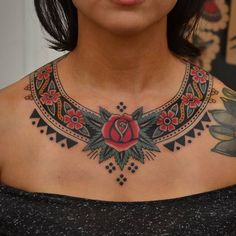 a woman with a tattoo on her chest