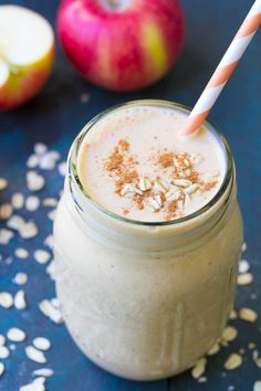 an apple pie smoothie in a mason jar with a straw and sprinkles