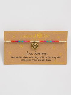 a bracelet with a message on it that says,'live happy remember that your day will go the way the corners of your mouth turns