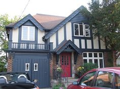 two cars parked in front of a house