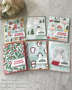 four cards with penguins and snowmen on them, one is for someone to make