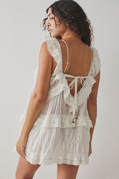 So femme and frilly, this billowy romper is featured in a soft cotton fabrication with lace detailing and ruffles throughout. **Fit:** Pull-on style, shorty-length **Features:** Soft cotton fabrication, lightweight design, square-neckline, lace detailing, tiered design with ruffled trim, adjustable tie at back, wide leg holes **Why We | Tiered And True Romper by Intimately at Free People in White, Size: L Loose Mini Dress, Sleeveless Rompers, People Dress, Boho Outfits, White Lace, Summer Women, Ruffles, Free People, Wide Leg