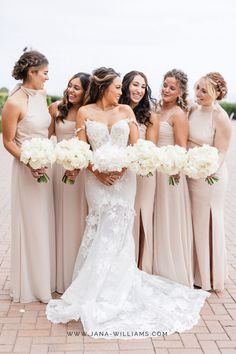 the bride and her bridesmaids are all wearing different styles of dresses for their wedding day