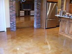 a large kitchen with an island and stainless steel appliances in the middle of the room