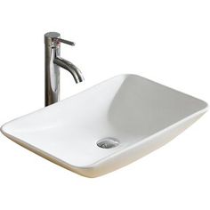 a white sink sitting under a faucet next to a metal faucet