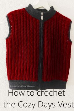 a red and black sweater vest hanging on a white wall with the words how to crochet the cozy days vest