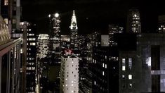 a view of the city at night from top of a building