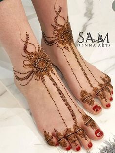 the feet are decorated with henna designs