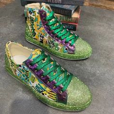 Step out in style with our Glamourous Glitter Shinny Sneakers!!! Designed for the bold and expressive, these low or high-top, colorful sneakers shimmer with a sparkling green texture and playful patterns. The bright green laces and metallic purple accents add a pop of contrast, while the reinforced toe cap ensures durability. Perfect for those who love to stand out, these sneakers offer both support and a dazzling statement piece for your feet. Make every stride a glamorous one – grab your pair Colorful Sneakers, Green Texture, Purple Accents, Green Lace, Bright Green, High Top, Shoes Flats, High Tops, Casual Shoes