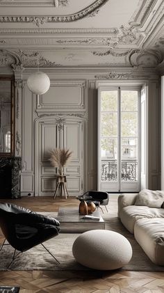 an elegant living room with white walls and flooring is pictured in this image, there are