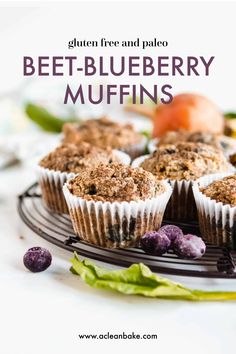 blueberry muffins are sitting on a wire rack